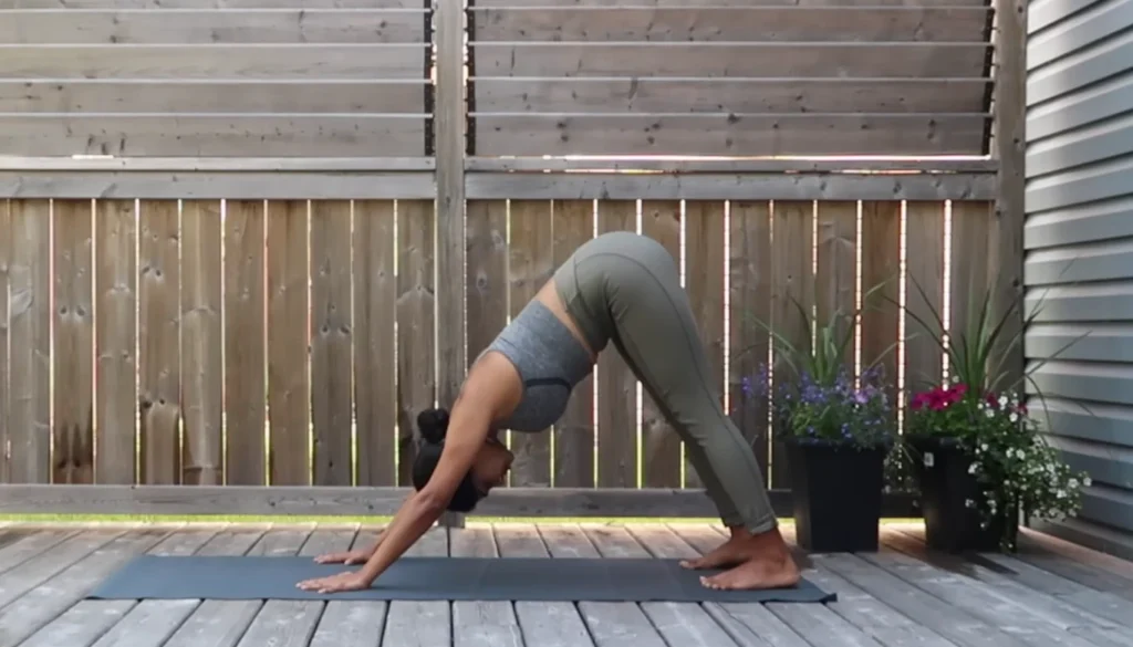 A lady performs a Somatic Cat-Cow for weight lose in somatic yoga