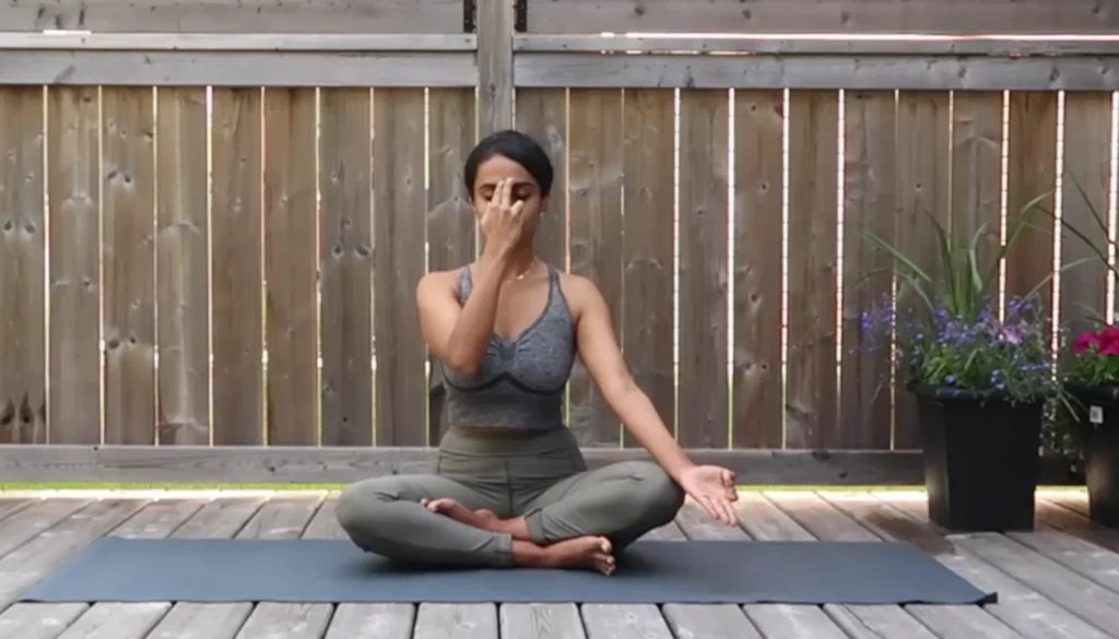 A lady performs a Somatic Sun Salutations pose for weight lose in somatic yoga