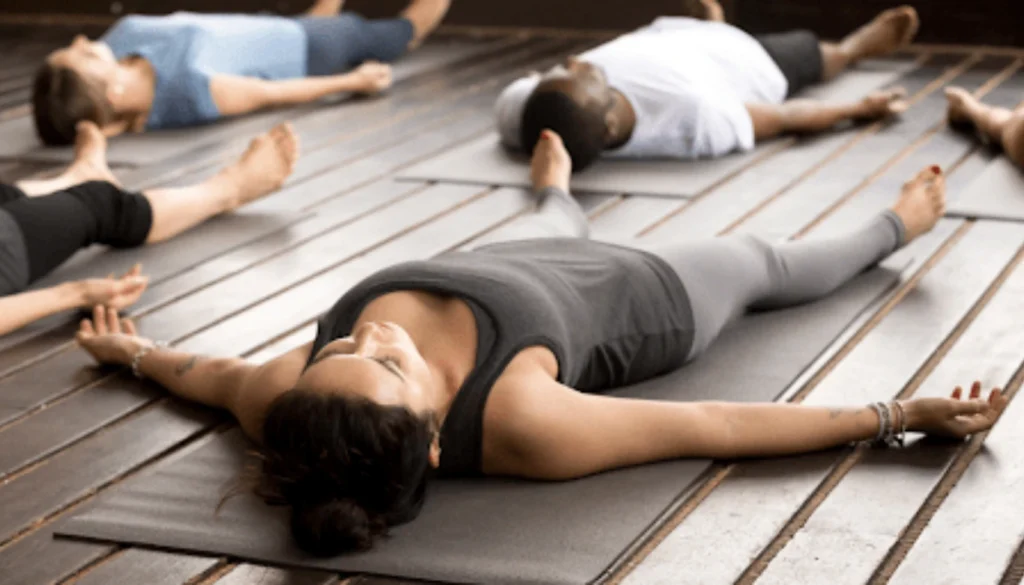 A lady performs a Body Scan pose