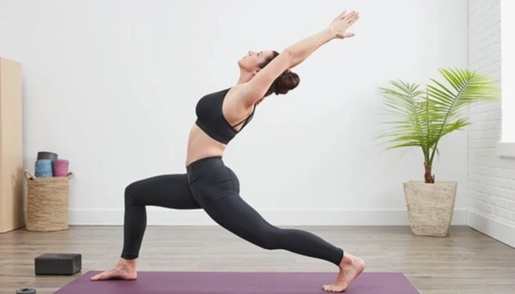 A lady performs a Crescent Moon Lunge