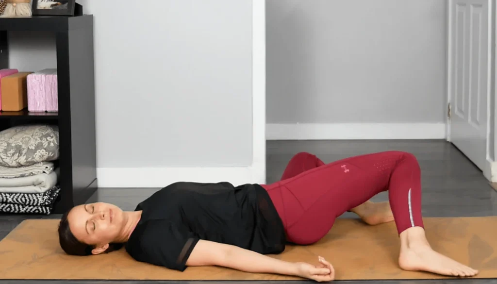 A lady laying on the flor and performs a Somatic Internal Hip Rotation