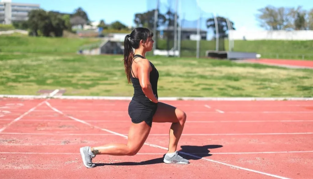 A lady performs a Upright Lunge