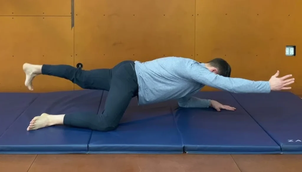 A man performs a diagonal stretches pose